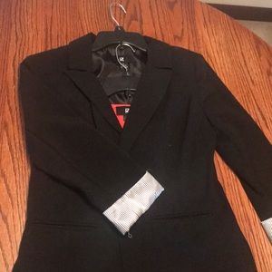 This is a shirt and blazer set.